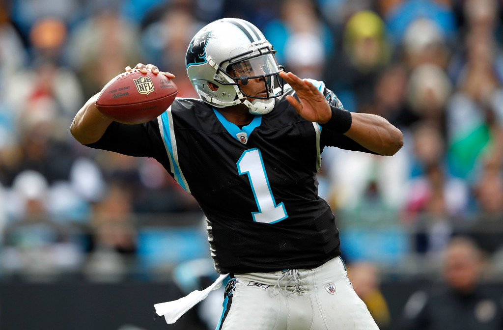 CHARLOTTE, NC - DECEMBER 24: Cam Newton #1 of the Carolina Panthers drops back to pass during their game against the Tampa Bay Buccaneers at Bank of America Stadium on December 24, 2011 in Charlotte, North Carolina. (Photo by Streeter Lecka/Getty Images)